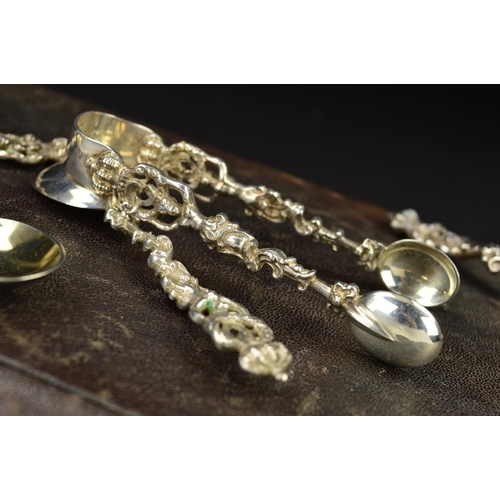 95 - A CASED SET OF TWELVE VICTORIAN SILVER TEASPOONS AND MATCHING SUGAR TONGS, cast with crown finials h... 