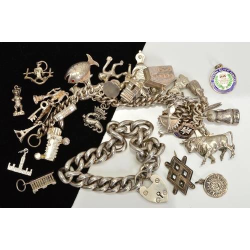 102 - A SELECTION OF SILVER AND WHITE METAL JEWELLERY, to include a large curb link bracelet with heart pa... 