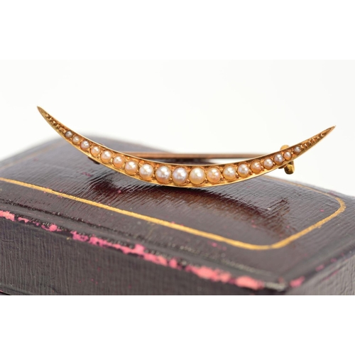 108 - AN EARLY 20TH CENTURY GOLD SEED PEARL CRESCENT BROOCH, stamped '15c', approximate gross weight 2.0 g... 