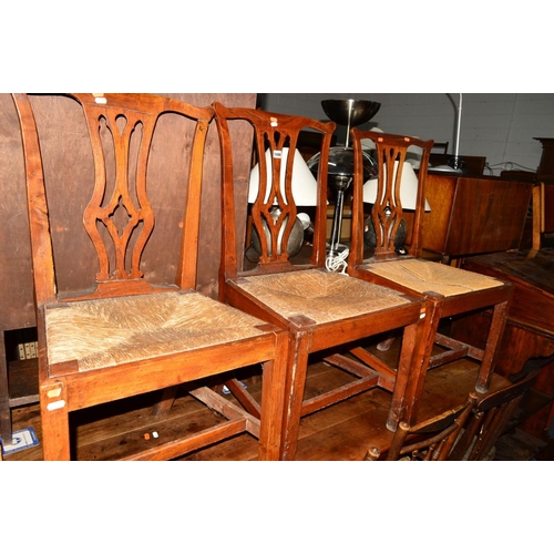 1446 - A SET OF THREE EARLY 19TH CENTURY OAK RUSH SEATED CHIPPENDALE STYLE CHAIRS, together with three othe... 