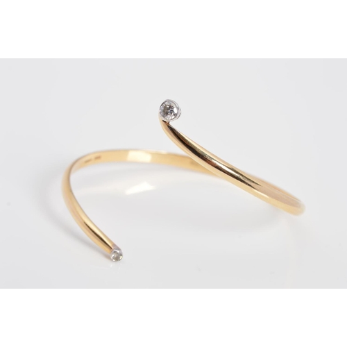 62 - A MODERN 9CT GOLD DIAMOND TORC BANGLE, two modern round brilliant cut diamonds, estimated total diam... 