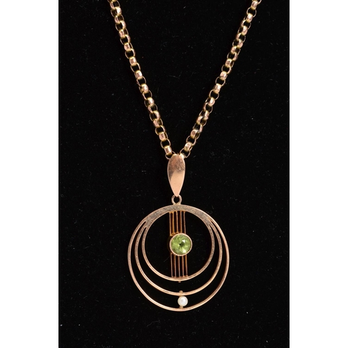 74 - AN EARLY 20TH CENTURY PERIDOT AND SEED PEARL CIRCULAR PENDANT, open work design, together with a rou... 