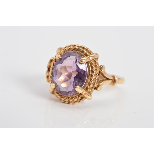 79 - A LATE 20TH CENTURY SINGLE STONE AMETHYST RING, twist rope edge to split shoulder design, amethyst m... 