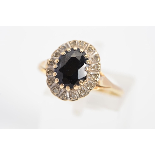 80 - A LATE 20TH CENTURY 9CT GOLD OVAL SAPPHIRE AND DIAMOND CLUSTER RING, ring size O, hallmarked 9ct gol... 