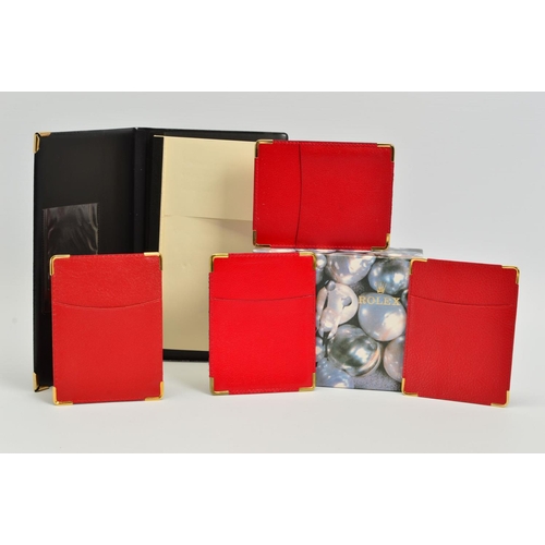 103 - A COLLECTION OF ROLEX ACCESSORIES, black note pad, four red Rolex card sleeves and a pearl design Ro... 