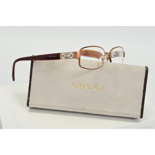 110 - A PAIR OF BULGARI READING GLASSES, with prescription lenses and brown/red coloured arms, stamped Mad... 