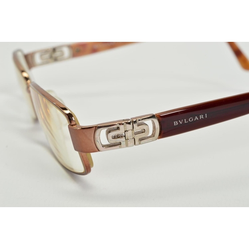 110 - A PAIR OF BULGARI READING GLASSES, with prescription lenses and brown/red coloured arms, stamped Mad... 