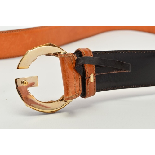 111 - A GUCCI LEATHER BELT WITH BAMBOO BUCKLE, the belt of tan leather with a G motif buckle in gold tone ... 