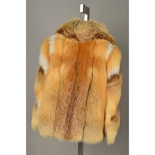 117 - A RED FOX FUR JACKET, with lapel collar, one hinged hook and eye fastening, tapered wide sleeves, em... 