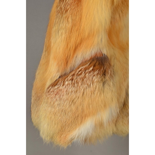 117 - A RED FOX FUR JACKET, with lapel collar, one hinged hook and eye fastening, tapered wide sleeves, em... 