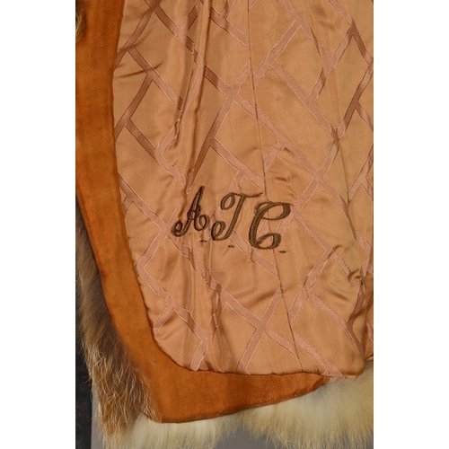 117 - A RED FOX FUR JACKET, with lapel collar, one hinged hook and eye fastening, tapered wide sleeves, em... 