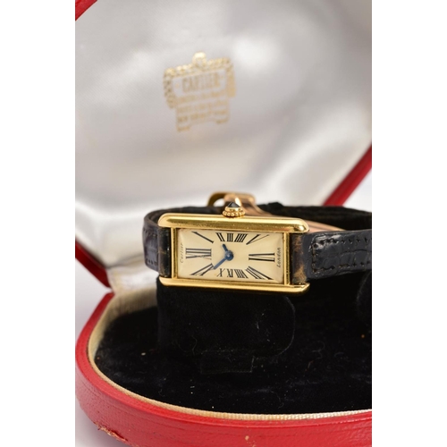 69 - AN 18CT CARTIER WRISTWATCH, long rectangular case, Roman numeral ivory tone dial signed Cartier, sig... 