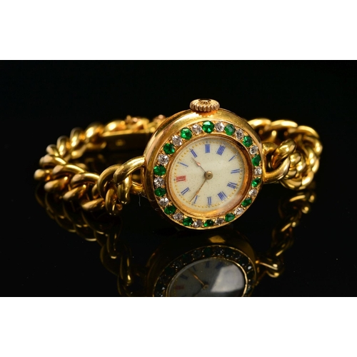 93 - AN EARLY 20TH CENTURY GOLD EMERALD AND DIAMOND WATCH, round case measuring approximately 25.0mm in d... 