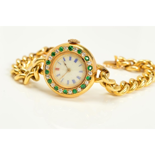 93 - AN EARLY 20TH CENTURY GOLD EMERALD AND DIAMOND WATCH, round case measuring approximately 25.0mm in d... 