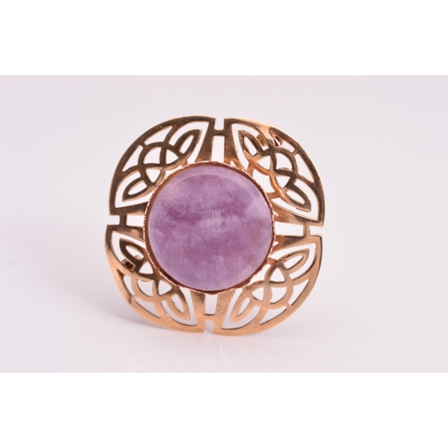 131 - AM 9CT GOLD AMETHYST BROOCH, designed as a tiered circular amethyst centre with Celtic design surrou... 