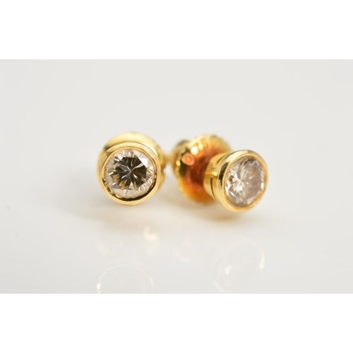 150 - A PAIR OF DIAMOND STUD EARRINGS, each designed as a round brilliant cut diamond within a collet sett... 