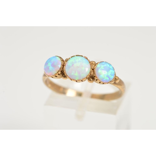 151 - A 9CT GOLD OPAL RING, designed as three graduated circular opal cabochons to the plain polished band... 