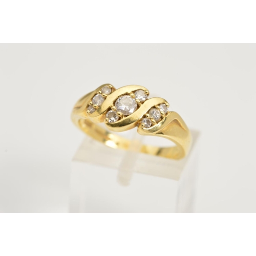 155 - AN 18CT GOLD DIAMOND RING, designed as three diagonal rows each set with three graduated round brill... 