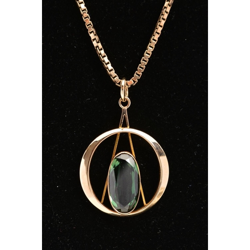 159 - A 9CT GOLD PENDANT NECKLACE, the circular open work pendant with a central elongated oval green gem ... 