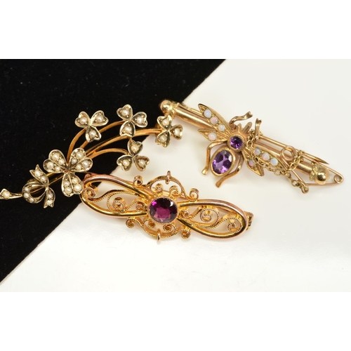 160 - THREE BROOCHES, THE FIRST AN EARLY 20TH CENTUR  9ct gold foliate brooch set with split pearls, the s... 