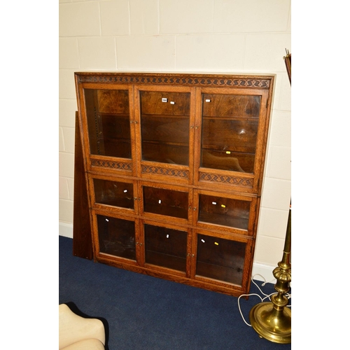 1668 - AN EARLY 20TH CENTURY OAK BOOKCASE OF GLOBE WERNICKE STYLE, three sections each with three glazed do... 