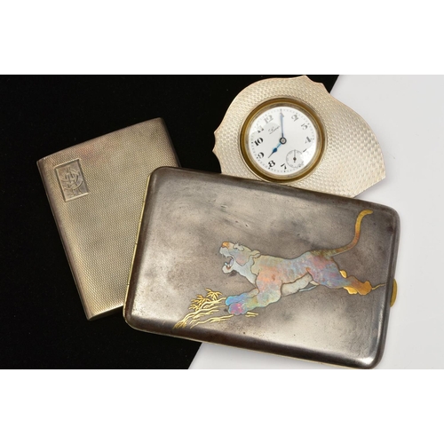 174 - THREE SILVER WARE ITEMS, to include a rectangular shakudo cigarette case depicting a tiger, a 1920's... 