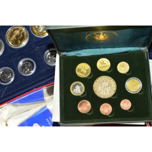 334 - FIVE COIN CASES AND A TIN OF COINS AND COMMEMORATIVES, to include many silver proofs, a rare 1992/93... 