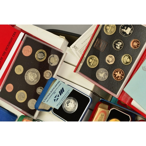 358 - A SUITCASE CONTAINING YEAR PROOF SETS, many proof silver coins, to include seventeen Royal Mint year... 