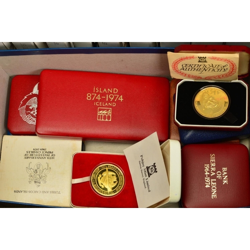 358 - A SUITCASE CONTAINING YEAR PROOF SETS, many proof silver coins, to include seventeen Royal Mint year... 