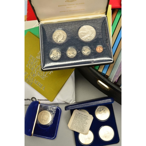 358 - A SUITCASE CONTAINING YEAR PROOF SETS, many proof silver coins, to include seventeen Royal Mint year... 