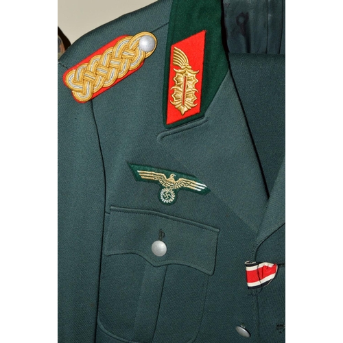 427 - FIVE ITEMS OF GERMAN MILITARY UNIFORMS, uniform jacket marked inside NVA, K, 48, 1850, T/1, the jack... 