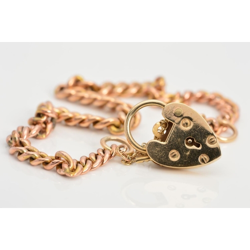 65 - A BRACELET, designed as a curb link bracelet to the 9ct heart padlock clasp with safety chain, clasp... 