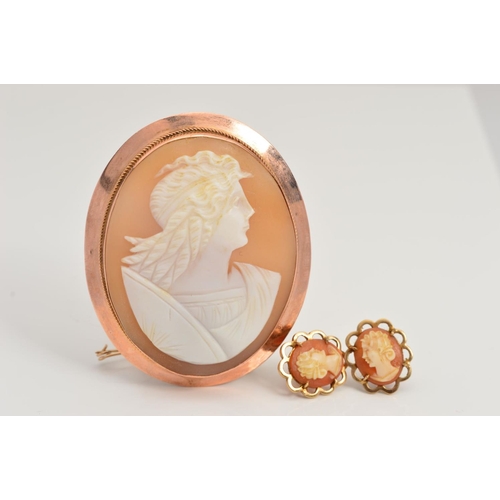 90 - A CAMEO BROOCH AND A PAIR OF CAMEO STUD EARRINGS, the brooch of oval outline carved to depict a God ... 