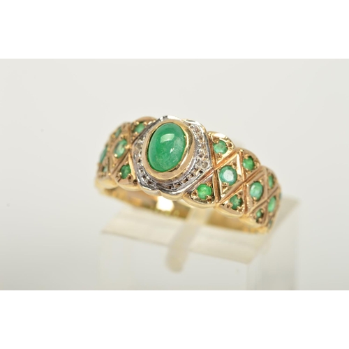 138 - A 9CT GOLD EMERALD AND DIAMOND RING, designed as a central oval emerald cabochon with single cut dia... 