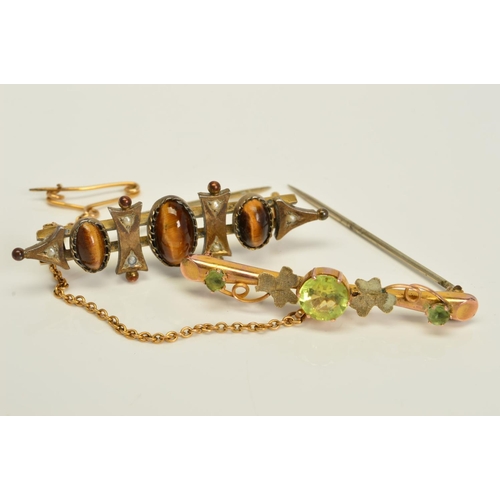 146 - TWO EARLY 20TH CENTURY BROOCHES, the first believed to be 9ct gold, set with a central circular gree... 