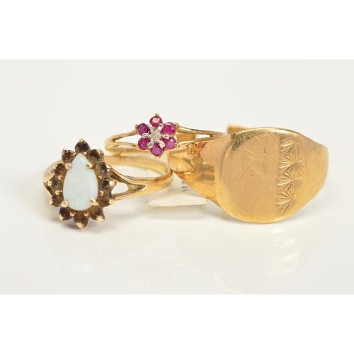 151 - THREE RINGS, the first a ruby and diamond cluster, the second a 9ct gold opal and sapphire pear shap... 