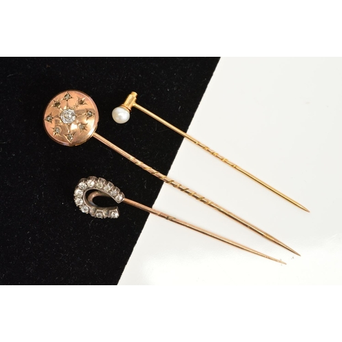 159 - TWO VICTORIAN GOLD AND DIAMOND STICKPINS, the first with a round domed disc, centring on an old Euro... 