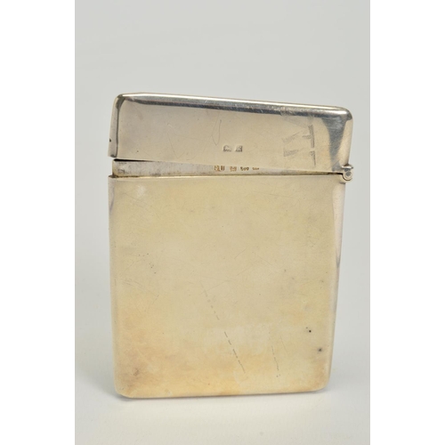 171 - AN EDWARDIAN SILVER CARD CASE, of rectangular form, plain exterior with hinged top, maker George Uni... 