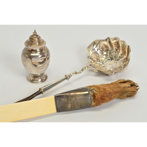 173 - A LATE GEORGIAN SILVER PUNCH LADLE, the wavy oval bowl repousse decorated with foliate decoration, o... 