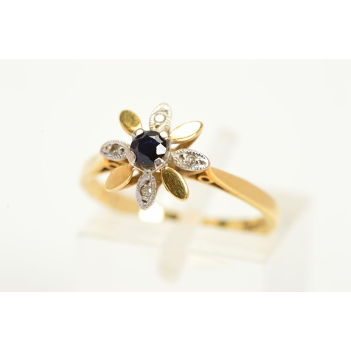 177 - AN 18CT GOLD SAPPHIRE AND DIAMOND FLOWER RING, designed as a central claw set circular sapphire, wit... 