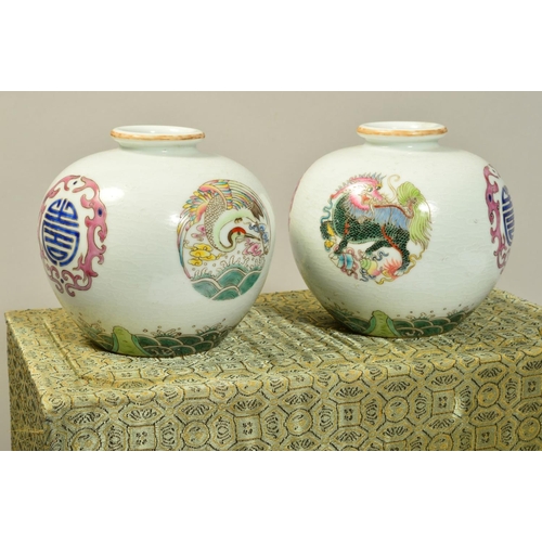 708 - A BOXED PAIR OF SMALL BULBOUS CHINESE VASES, stork and mythical creature medallions, orange characte... 