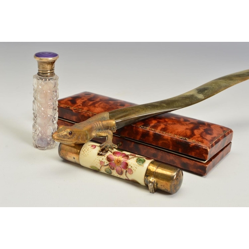 106 - A VICTORIAN SILVER GILT AND CERAMIC CYLINDRICAL DOUBLE ENDED SCENT BOTTLE, the ivory ground painted ... 