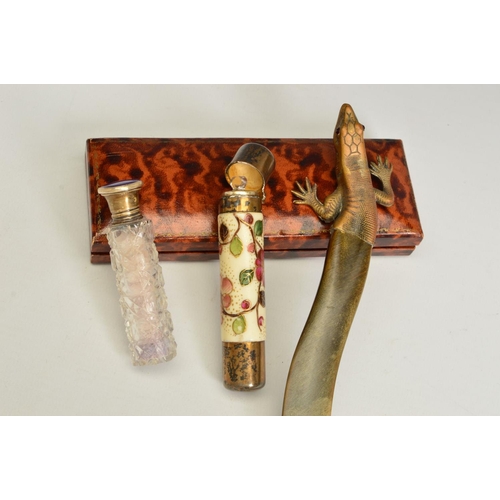 106 - A VICTORIAN SILVER GILT AND CERAMIC CYLINDRICAL DOUBLE ENDED SCENT BOTTLE, the ivory ground painted ... 