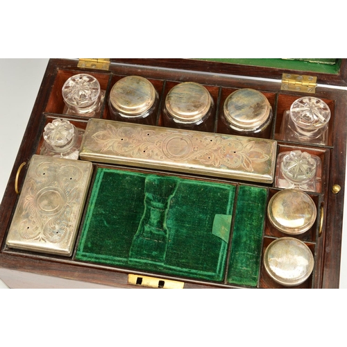 110 - A LATE VICTORIAN WALNUT AND GILT BRASS BOUND DRESSING BOX, of rectangular form, with tooled green le... 