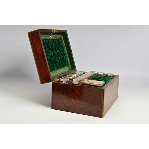 110 - A LATE VICTORIAN WALNUT AND GILT BRASS BOUND DRESSING BOX, of rectangular form, with tooled green le... 