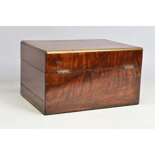 110 - A LATE VICTORIAN WALNUT AND GILT BRASS BOUND DRESSING BOX, of rectangular form, with tooled green le... 