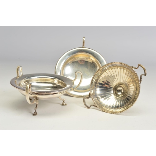 118 - A PAIR OF GEORGE V SILVER BON BON DISHES, of circular form, with three open scrolled handles and scr... 