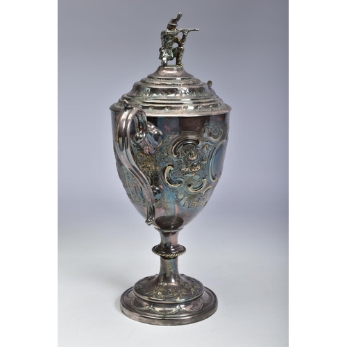 124 - A LATE VICTORIAN SILVER PLATED TWIN HANDLED TROPHY CUP OF MILITARY INTEREST, the pull off cover with... 