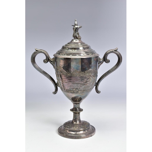 124 - A LATE VICTORIAN SILVER PLATED TWIN HANDLED TROPHY CUP OF MILITARY INTEREST, the pull off cover with... 