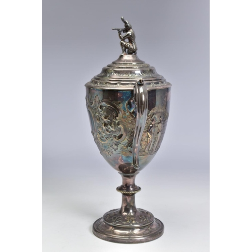 124 - A LATE VICTORIAN SILVER PLATED TWIN HANDLED TROPHY CUP OF MILITARY INTEREST, the pull off cover with... 